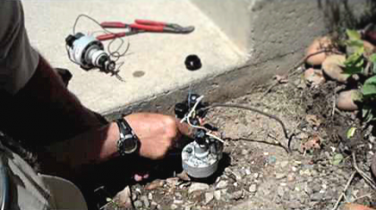 San Bruno sprinkler repair technician rewires a controller valve